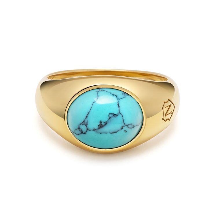 The Gold Oval Signet Ring with Turquoise Stone is a luxurious fusion of elegance and sophistication. With its polished turquoise gemstone set in sophisticated gold, it exudes timeless style and refinement. Whether worn for special occasions or as a daily accessory, this ring is sure to make a statement and become a cherished heirloom.  Please note that all our pieces are crafted by hand and one-of-a-kind, and may therefore vary slightly in size, shape, and color. Ring in Stainless Steel with Gol Classic Turquoise Ring For Formal Occasions, Classic Formal Turquoise Ring, Classic Turquoise Signet Ring As Gift, Oval Gold Turquoise Ring Fine Jewelry, Luxury Oval Turquoise Gemstone Ring, Classic Turquoise Ring With Polished Finish, Classic Yellow Gold Turquoise Gemstone Ring, Luxury 14k Yellow Gold Turquoise Ring, Luxury Oval Turquoise Ring