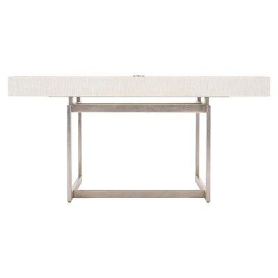 a table with a white top and silver metal frame, on a white background is the image