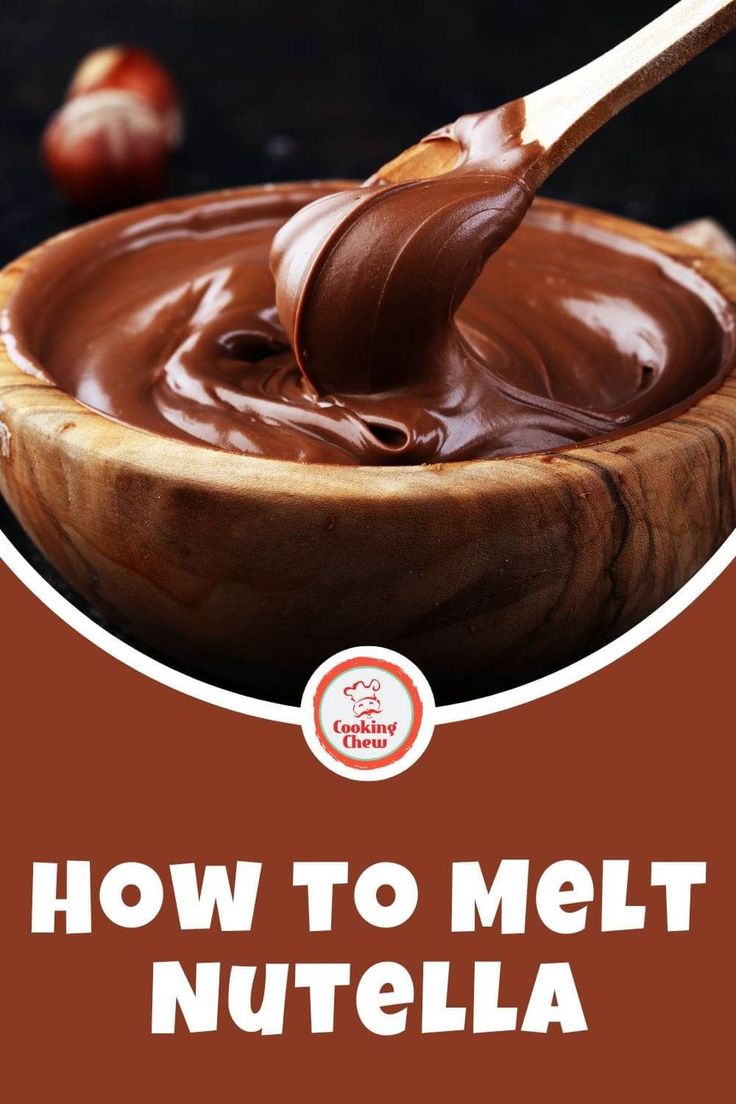 a wooden bowl filled with melted chocolate on top of a table