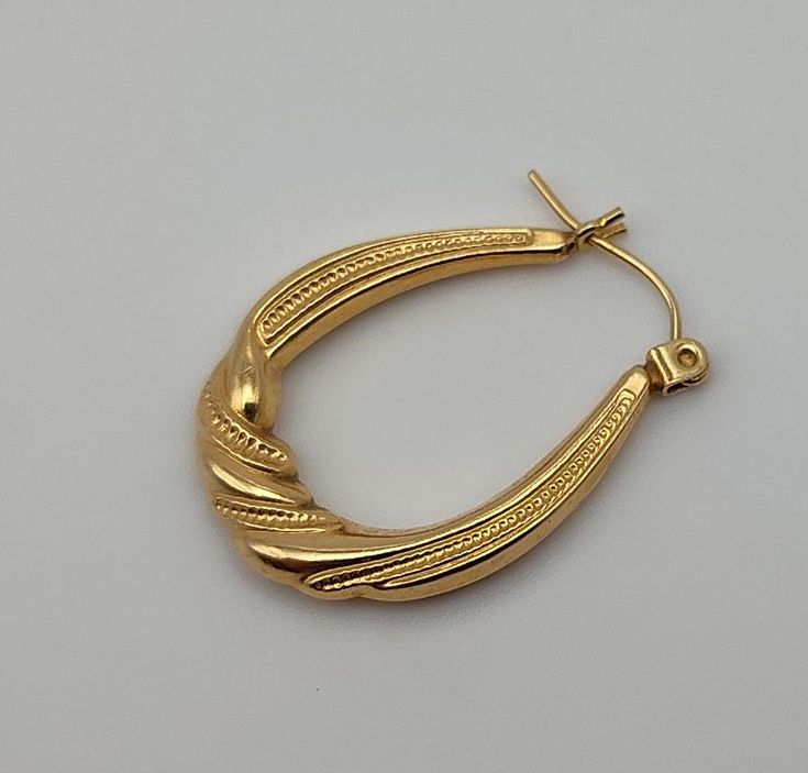 Single 14K Oval Hoop Tube with Twist Yellow Gold Post Earring Vintage Karat KT Solid Pierced (only 1 earring) Materials: 14K solid gold metal marked - 585 = 14K Condition: very good vintage & are hollow - with one ding that I see (in last image close-up) Weight in grams - .69 Measures - 1 x 3/4 x  1/8 inches Maker's mark - ZZ with a mark but I cannot make it out Questions welcome. Oval Tarnish Resistant Hoop Earrings As Gift, Oval Tarnish Resistant Hoop Earrings For Gift, Oval Gold Plated Hoop Earrings For Formal Occasions, Oval 14k Gold Tarnish-resistant Hoop Earrings, Oval Yellow Gold-plated Hoop Earrings, Oval 14k Gold Tarnish Resistant Hoop Earrings, 14k Gold Oval Hoop Earrings Tarnish Resistant, Oval Yellow Gold Plated Hoop Earrings, Yellow Gold Oval Hoop Earrings With Ear Wire