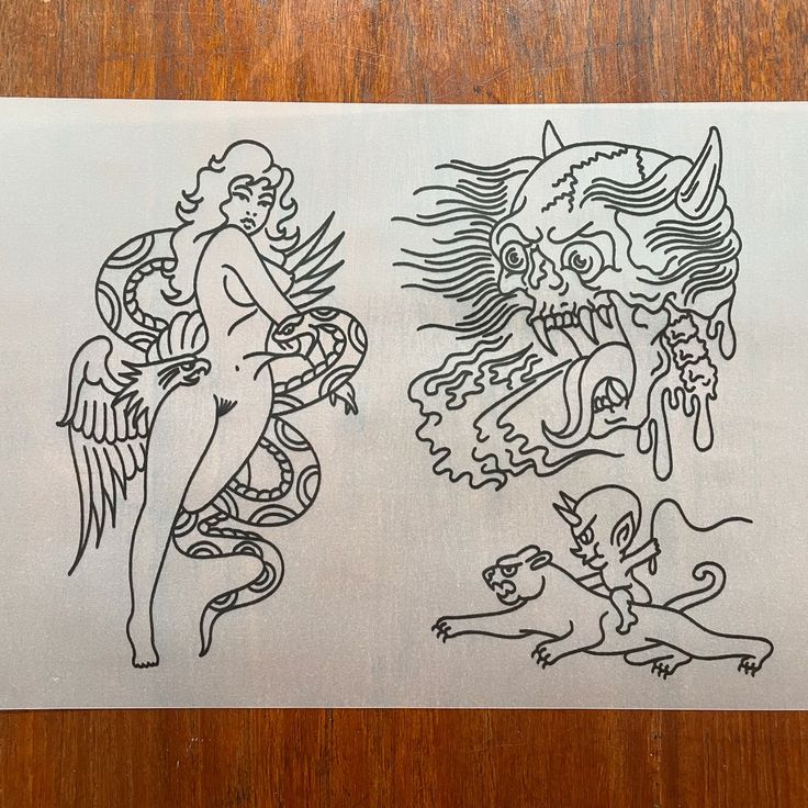 an image of two drawings on a piece of paper that is sitting on a table