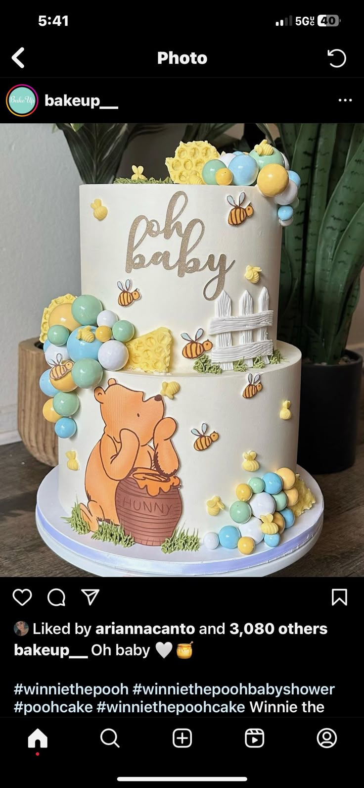 a winnie the pooh baby cake with balloons and honeycombs on top is featured in an instagram