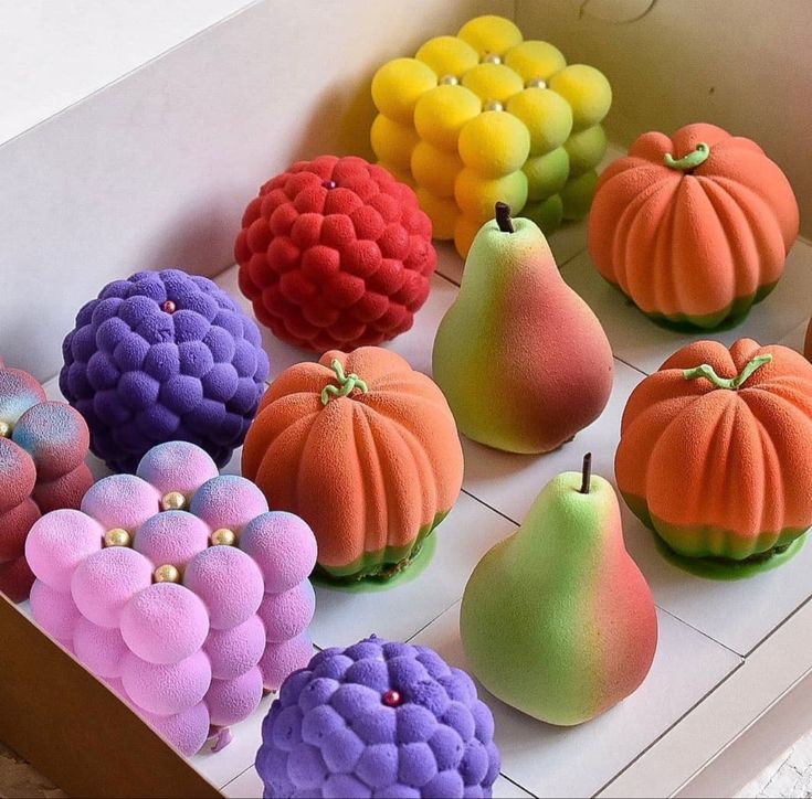 a box filled with different types of fake fruit