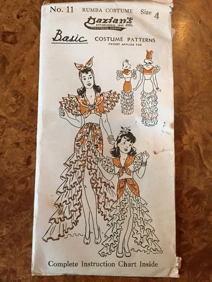 an old paper with two women dressed in costumes on it's front and back