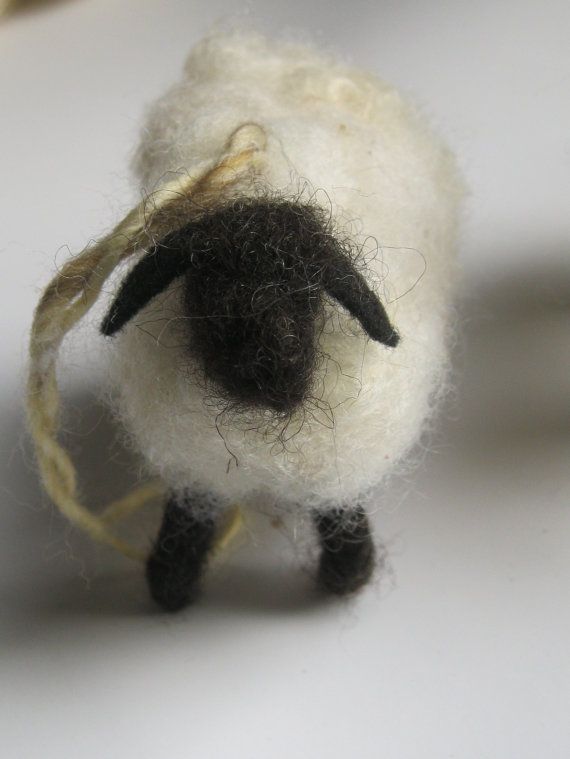 there is a small stuffed animal that looks like it has been made out of wool