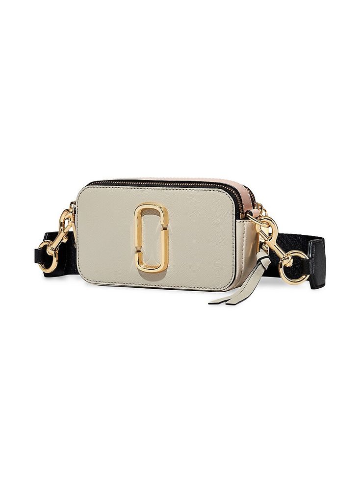 "Find MARC JACOBS The Snapshot on Editorialist. Marc Jacobs' signature camera bag silhouette featuring a striped webbing strap and colorblock leather construction. Adjustable removable crossbody strap Dual top zip Goldtone hardware 2 interior compartments Interior slip pocket Leather Imported SIZE 7.5\"W x 4.5\"H x 2.5\"D. Marc Jacobs. Color: Coconut." Marc Jacobs Handbag, Leather Camera Bag, Bold Logo, Marc Jacobs Bag, Crossbody Tote, Body Bag, Cow Leather, Leather Crossbody Bag, Leather Crossbody