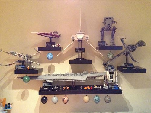 a wall mounted with legos and star wars action figures