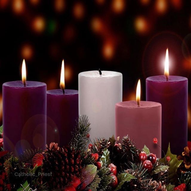 three lit candles with christmas decorations around them