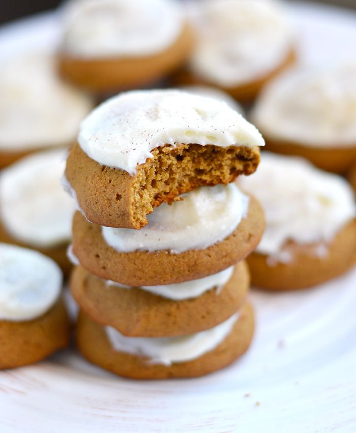 a plate with some cookies and frosting on top of each other, stacked up