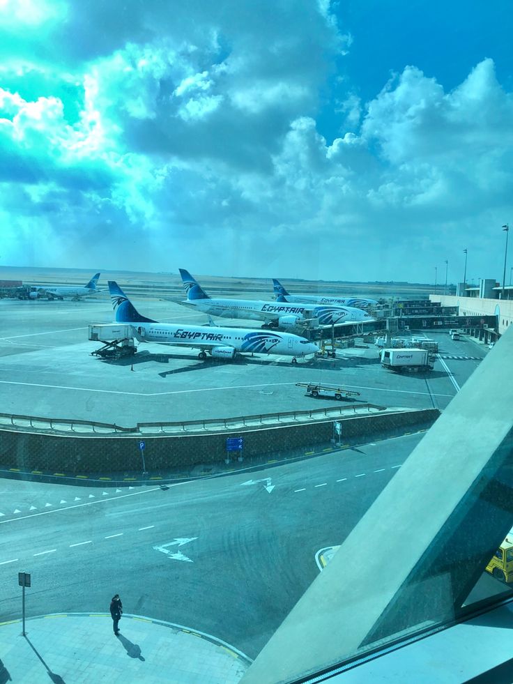 an airport with several planes parked on the tarmac