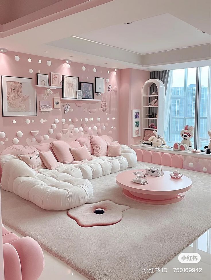 a pink and white living room with lots of pillows on the couch, coffee table