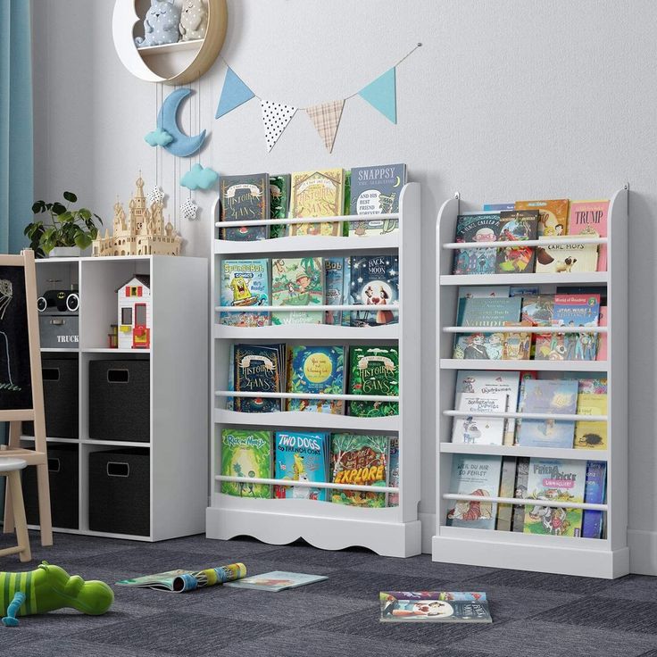 a child's room with bookshelves, toys and other items on the floor