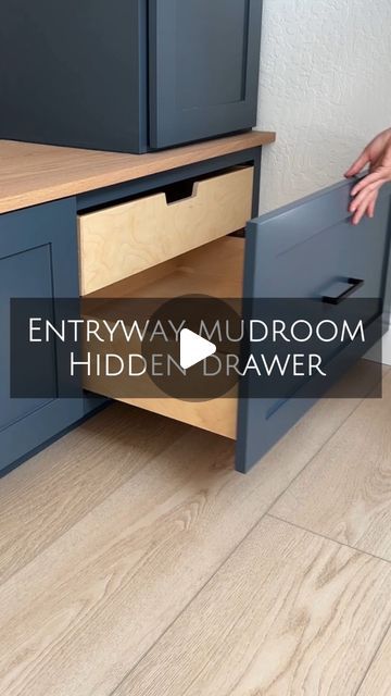 a kitchen cabinet with the words entry way mudroom hidden drawer