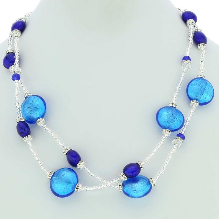 Tender and feminine, elegant and rich, this fashionable Murano Glass necklace is so beautiful it is guaranteed to appeal to all tastes and styles. Crafted by hand in a family workshop on Murano island, this is certainly not your run-of-the-mill piece of jewelry that you could one day spot on someone else. Not only is this necklace finely crafted and masterfully designed, reflecting the rare skill of the master glass-makers, it is also bursting with the most beautiful shade of blue color you can Elegant Blue Necklace With Round Beads, Elegant Turquoise Glass Jewelry, Elegant Double Strand Turquoise Beaded Necklace, Elegant Turquoise Double Strand Beaded Necklaces, Elegant Multi-strand Glass Beaded Necklaces, Elegant Long Blue Beaded Necklace, Elegant Multi-strand Turquoise Jewelry, Elegant Turquoise Multi-strand Jewelry, Elegant Multi-strand Glass Necklaces