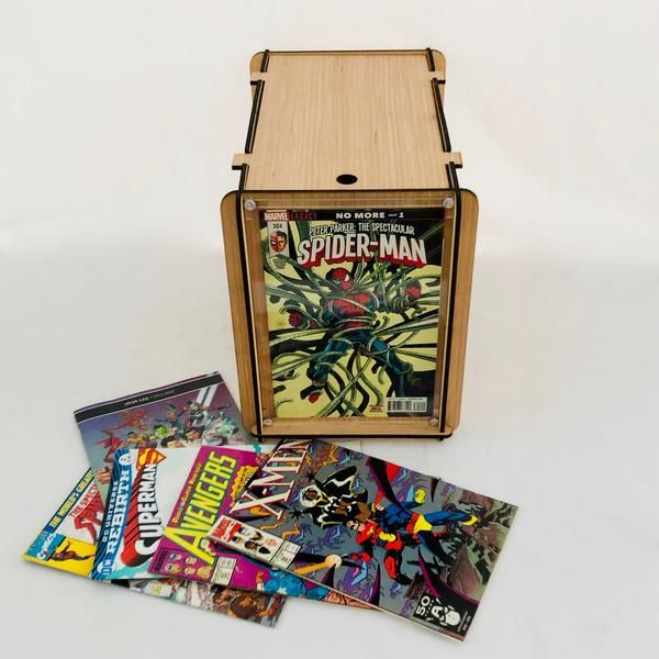 a wooden box with some comics on top of it and several other items around it