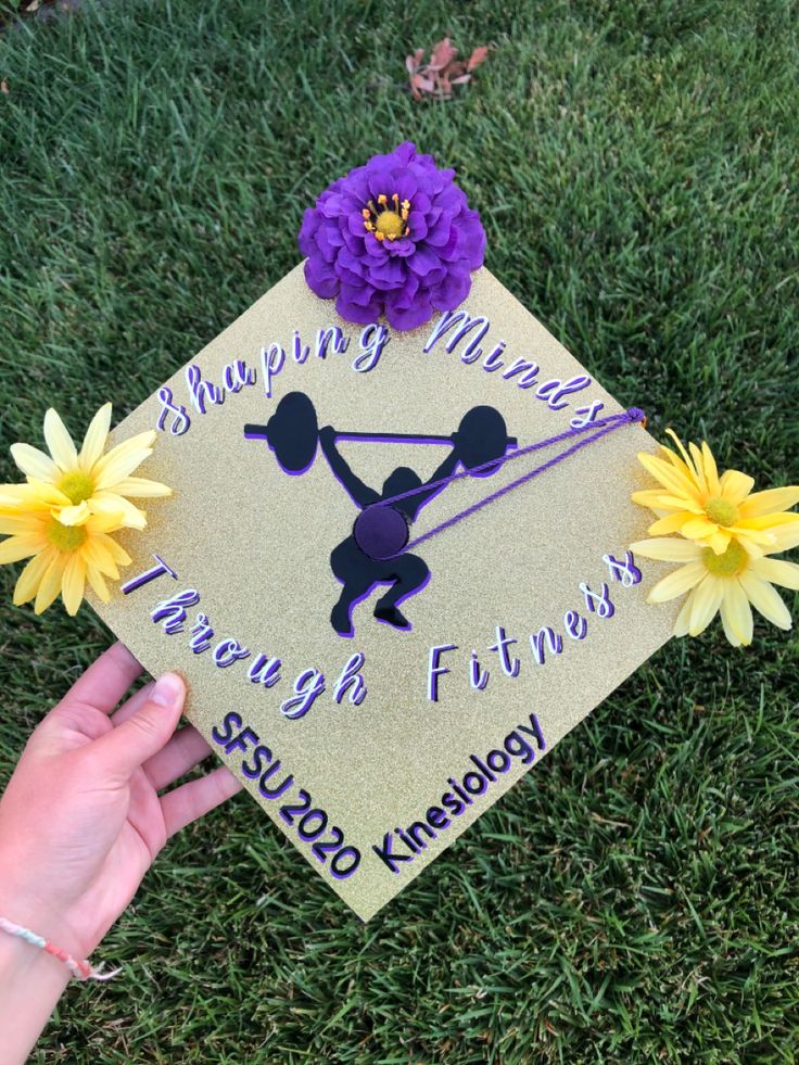 a graduation cap with flowers on it and the words happy mother through fitness written on it