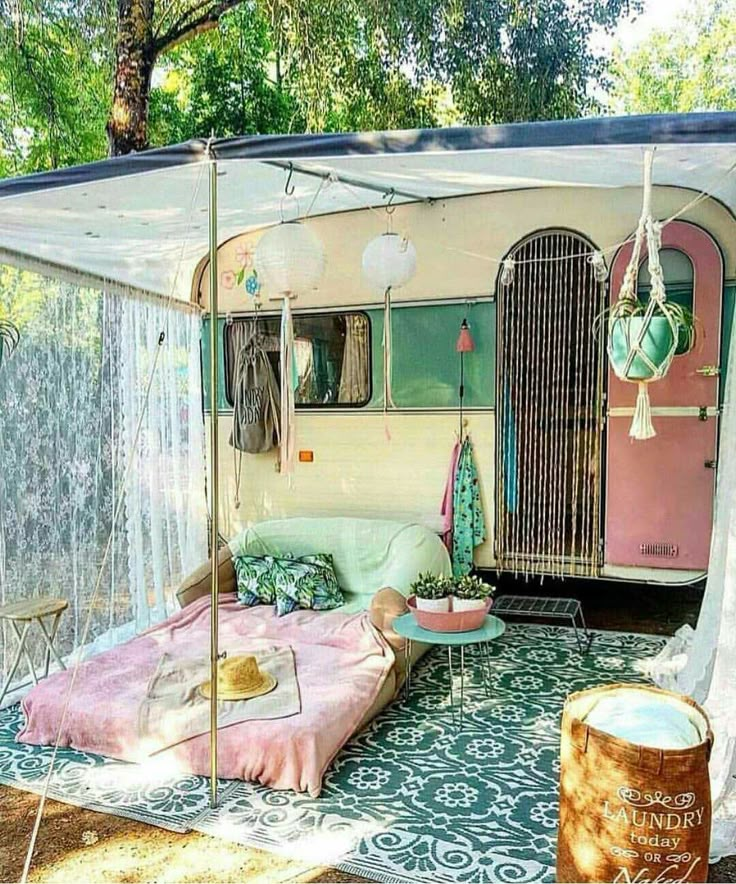 an old camper trailer has been converted into a bed and tent for the kids