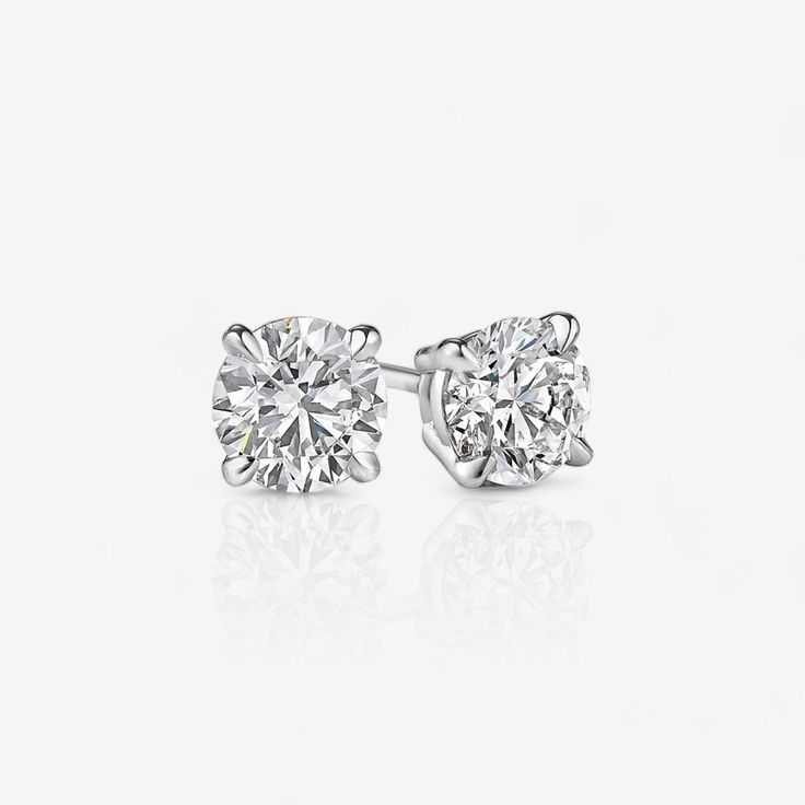 Timeless and beautiful, round diamond stud earrings add a classic elegance to any occasion; secured with four prongs. Not sure what backing type to get? Push-backs, also called friction backs, are the most common kind of earring backs. Screw-backs add extra security, so we recommend them for higher value earrings. Jumbo-backs, which are oversized push-backs, can be helpful for keeping oversized earrings from drooping. We recommend jumbo-backs for four-prong earrings that are 3.00 CTW and above. Round Diamond Stud Earrings, 1 Carat Engagement Rings, Round Diamond Earrings, Diamond Earrings Studs Round, Oversized Earrings, Diamond Earring, Yellow Gold Engagement Rings, Gold Necklace Layered, Diamond Stud Earrings