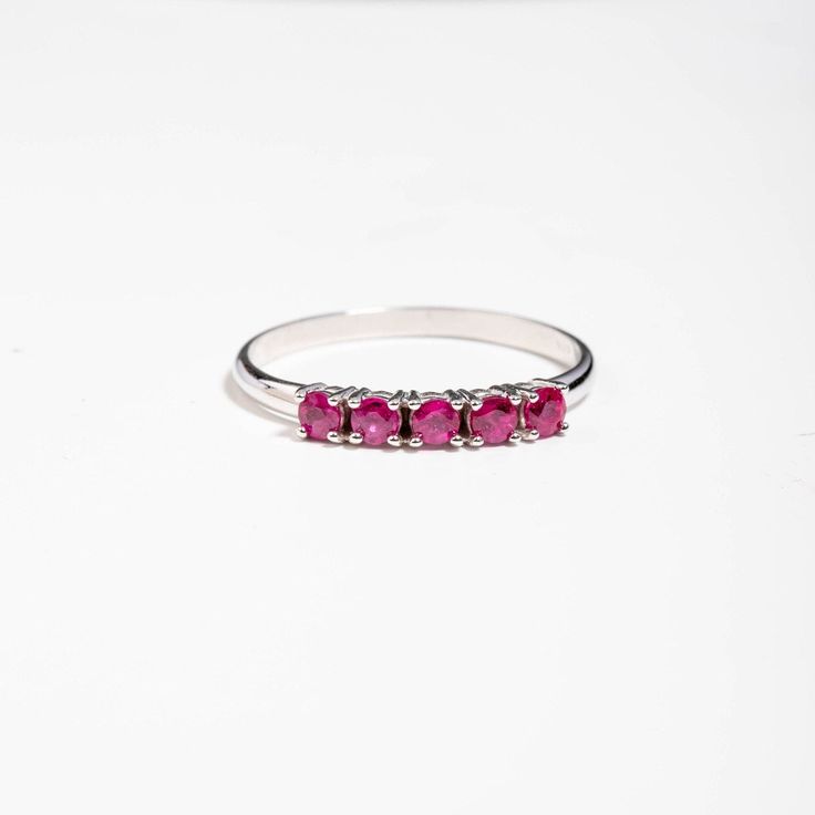 A stacking 5 stone ruby ring in 14K solid white gold. It is ideal for an anniversary gift for women or for an alternative wedding band. This dainty ruby cluster is also a great birthday gift, because ruby is the July birthstone. 100% handcrafted with love! PRODUCT DETAILS ● Material : 14K solid gold - white gold - rose gold ● Gemstones: 5 Rubies natural ● Ruby's Diameter: 2.5mm ● Rubies Weight: 0.41ct ● Gemstones shape: Round/ Brilliant cut RING SIZING For General Reference: ● we use standard US Stackable Ruby Ring For Formal Occasions, Stackable White Gold Ruby Ring, White Gold Ruby Ring With Half Eternity For Promise, Classic Stackable Ruby Ring With Round Cut, White Gold Ruby Half Eternity Promise Ring, Classic Stackable Ruby Ring For Anniversary, Classic Ruby Half Eternity Ring As Gift, Formal Stackable Ruby Ring In Sterling Silver, Classic Half Eternity Ruby Ring Gift