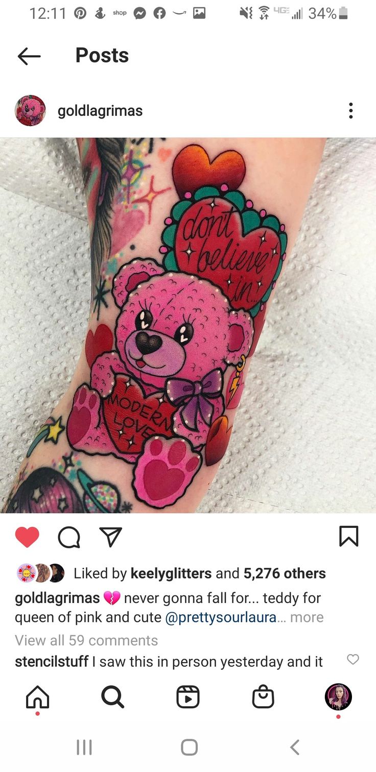 a pink teddy bear tattoo on the arm