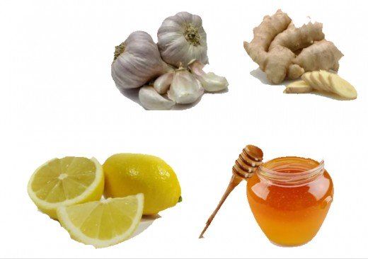 lemons, ginger, garlic and honey are shown in this image