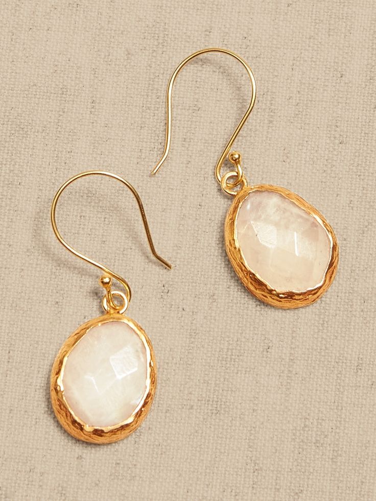 ECLECTIC STONE COLLECTION: The earth is full of fascinating treasures in the form of minerals and stones.  From quartz to pyrite, this collection favors unique jewelry settings that highlight all the best qualities of some of our favorite semi-precio Minimalist Faceted Drop Earrings, Gold Moonstone Jewelry With Gemstone Accents, Luxury Teardrop Natural Stone Jewelry, Elegant Moonstone Jewelry With Birthstone, Elegant Moonstone Birthstone Jewelry, Delicate Natural Stone Drop Earrings, Delicate Drop Earrings With Natural Stones, Yellow Gold Drop Earrings With Natural Stones, Fine Jewelry Brass Gemstone