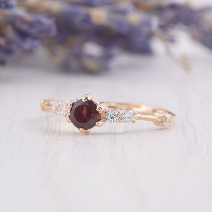 Simple & dainty 14k rose gold garnet engagement ring, Small tiny womens engagement ring,Garnet promise ring for her,Gold womens promise ring WE OFFER UNLIMITED PERIOD INSTALLMENTS PLAN This is a beautiful, stunning, feminine ring that works well for all occasions, styles, and ages. You will love it! Ring information: Main stone: Garnet Approximate size: 4.0mm Accent stones: Cubic zirconia Approximate size: 1.75mm (6 stones) Metal type: Gold Metal stamp: 14k Gold Installment Payments We offer Garnet Diamond Promise Ring In Yellow Gold, Garnet Diamond Ring With Prong Setting For Promise, Garnet Diamond Ring For Promise, Yellow Gold Garnet Diamond Promise Ring, Elegant 14k Rose Gold Ruby Promise Ring, Dainty Round Ruby Promise Ring, Dainty Ruby Promise Ring, Dainty Ruby Ring With Prong Setting For Promise, Dainty Rose Gold Ruby Promise Ring