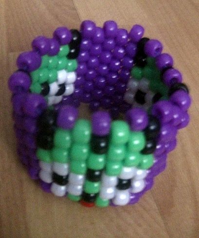 a bracelet made out of beads and plastic beads