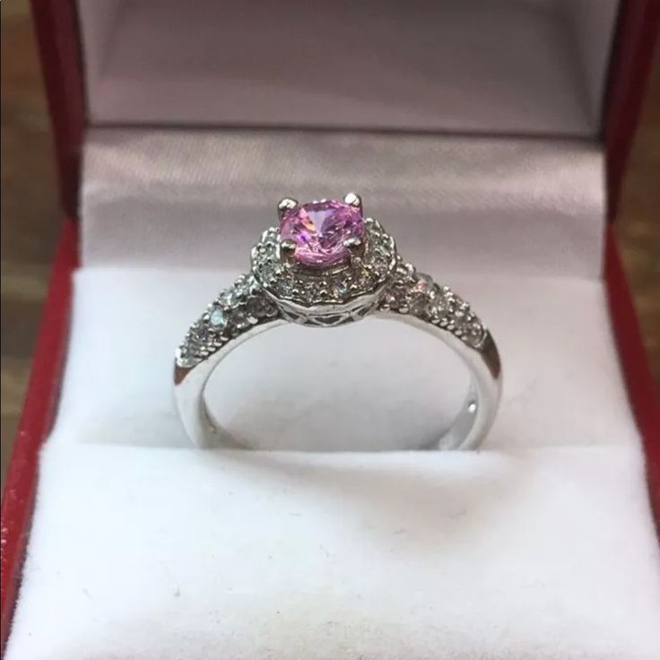 New Cubic Zirconia Handset Engagement Ring 14k White Gold Layer On Solid .925 Sterling Silver Size - 7.75 Top Width : 0.35" Inches (8.9 Mm) Top Height : 0.35" Inches (8.9 Mm) This Ring Can Be Resize Please Message Us If You Need Resizing Before You Buy . Free Gift Box Plus Don't Forget To Follow Us On Facebook, Instagram, Twitter, And Youtube . Thanks Item # Jn03261753-S-053 Classic Pink Cluster Ring For Anniversary, Dazzling Pink Sterling Silver Ring, Pink Sterling Silver Wedding Jewelry With Accent Stones, Pink Sterling Silver Diamond Ring With Halo Setting, Pink Sterling Silver Diamond Ring With Accent Stones, Pink Sterling Silver Wedding Ring With Halo Setting, Birthstone Ring With Diamond Accents As Gift, Pink Diamond Ring With Halo Setting For Promise, Pink Diamond Accented Promise Rings