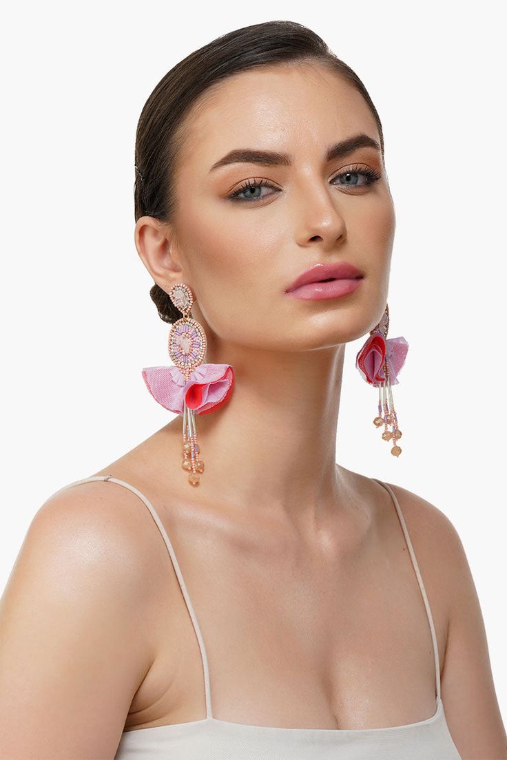 Beaded Earrings in an oval shape design Fabric petal flower details Cascading 4 beaded fringe Tops Attachment with Jumpring and Back Pin Hand crafted in Pink, Purple, Silver, Rose Gold Colour Beads. Elevate your style with our Pink Blossom Beaded Earrings, a unique blend of elegance and charm. These exquisite, handcrafted earrings feature an oval shape design adorned with delicate fabric petal flower details, adding a touch of floral grace to your ensemble. Cascading from the oval base are four Elegant Pink Flower Beaded Earrings, Unique Pink Dangle Beaded Earrings, Fringe Tops, Colorful Beaded Flower-shaped Earrings, Adjustable Colorful Beaded Flower-shaped Earrings, Chic Pink Flower-shaped Earrings, Rose Gold Colour, Fringe Top, Petal Flower