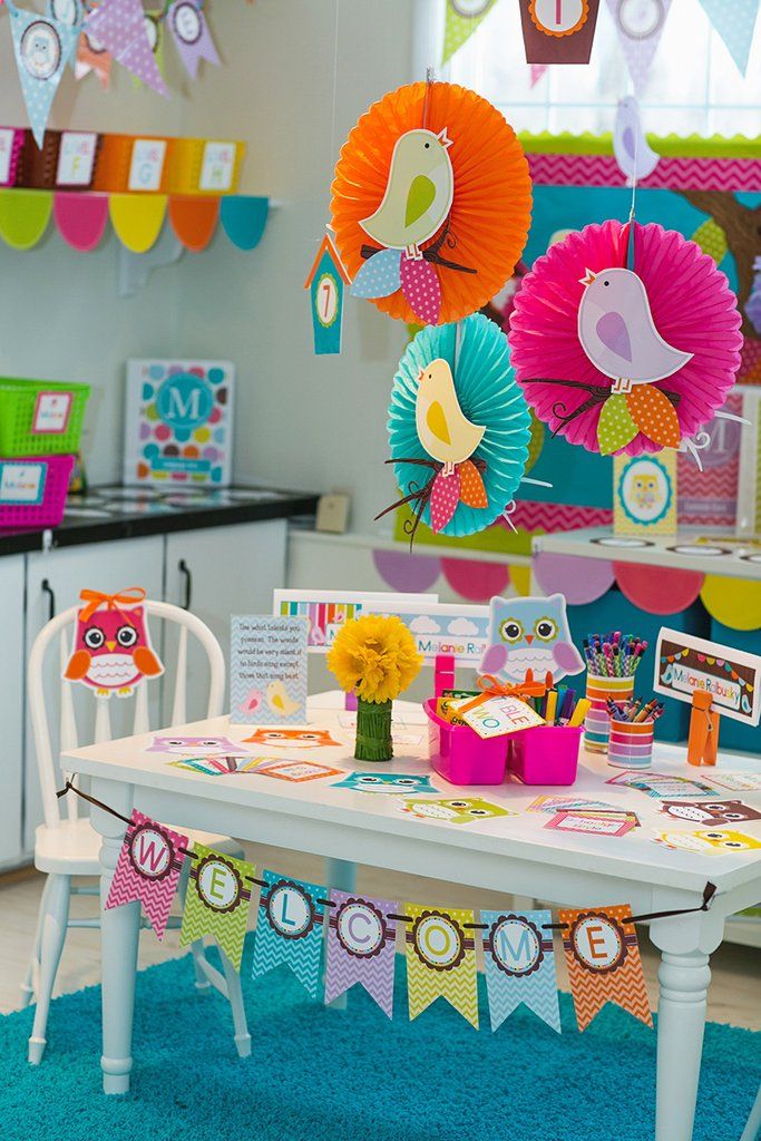 a room filled with lots of colorful decorations and decorating on the wall above a table