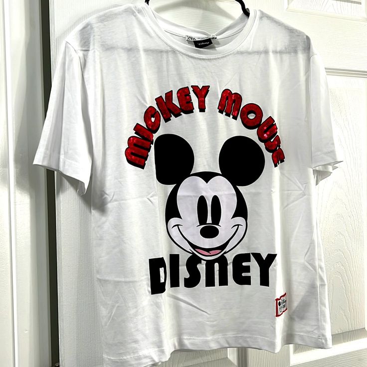 Brand New Everything Is Still Intact Bought This At Zara White Mickey Mouse T-shirt For Streetwear, White Mickey Mouse Top For Streetwear, Trendy White Mickey Mouse Tops, Trendy White Tops With Mickey Mouse Design, Disney Letter Print Tops For Streetwear, Disney White Top With Letter Print, Trendy Mickey Mouse Short Sleeve Top, Fun White Mickey Mouse Tops, Casual White T-shirt For Disney Fan Events