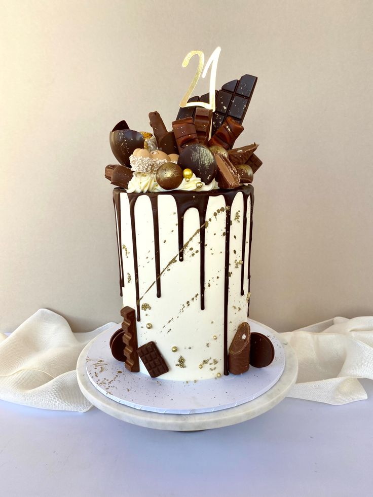 a white cake with chocolate and marshmallows on top