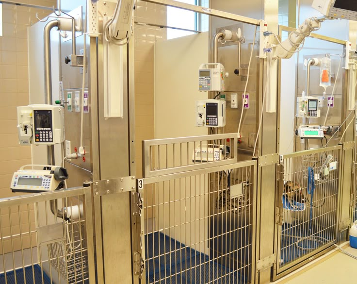 the inside of a hospital room with medical equipment on it's walls and floor