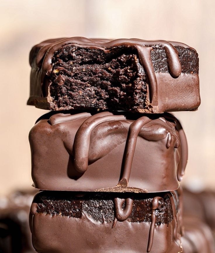 three pieces of chocolate cake stacked on top of each other