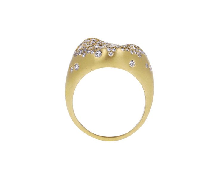 With its modern design and shimmering white diamonds, this Nada Ghazal ring is a playful take on the traditional cocktail ring. The three dimensional 18K yellow gold ring face is encrusted in a surface of sparkling, round white diamond pavé and sits at the center of the 18K yellow gold band. As a middle finger ring it will command attention, but it could also be worn as an alternative to the traditional engagement ring for someone with an edgy, modern style. 18K yellow gold ring face : just unde Yellow Gold Diamond Rings For Party, Party Diamond Ring With Accents In Yellow Gold, Gold Rings With Pave Setting For Party, Yellow Gold Diamond Ring With Accents For Parties, Dazzling Yellow Gold Rings For Party, Party Yellow Gold Diamond Ring With Accents, Dazzling Yellow Gold Party Rings, Party Diamond Ring In Yellow Gold, Party Yellow Gold Diamond Ring