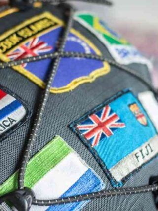 the inside of a baseball cap with many different flags on it