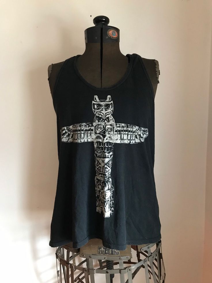 Vintage Ralph Lauren Tribal Shirt Distressed styling Totem pole Graphic  Black and white  tank  top Racer back style tank style T shirt Cowhichan inspired  Workwear  100% Cotton Ralph Lauren Denim and Supply  Size woman's small Approximate measurements in inches: pit to pit: 34 26 down center back length from shoulder to bottom hem: 23.25 Sleeve 25.50 Grunge Tank T-shirt For Summer, Summer Grunge Tank T-shirt, Summer Grunge Tops With Back Print, Casual Tank Top For Alternative Fashion, Summer Punk Tops With Screen Print, Punk Style Screen Print Tops For Summer, Summer Punk Style Screen Printed Tops, Punk Style Summer Tops With Screen Print, Summer Festival Crew Neck Tank Top