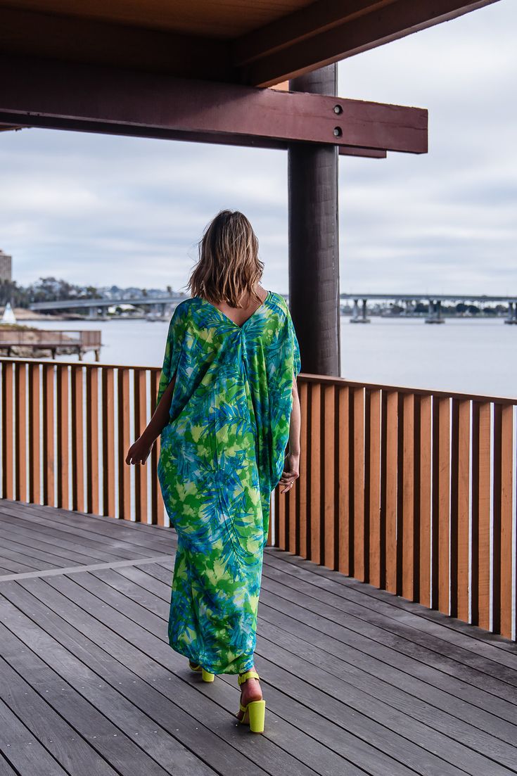 Make a statement with our breezy Biscayne Bay Caftan. This exquisite garment is more than just a piece of clothing; it's a celebration of fabric in all its glory. Crafted with generous amounts of fluorescent lime green and electric turquoise rayon georgette and lots of love, this piece offers an airy fit designed to drape beautifully on all body types. Whether worn poolside for a day at the cabana or layered and adorned with your favorite accessories for a glamorous evening affair, it's a versat Beach Wardrobe, Summer Color Palette, September Birthstone Jewelry, Stocking Fillers For Her, Street Design, Forever Jewelry, Jewelry Ring Box, Pearl Jewellery Earrings, Mens Jewelry Bracelet