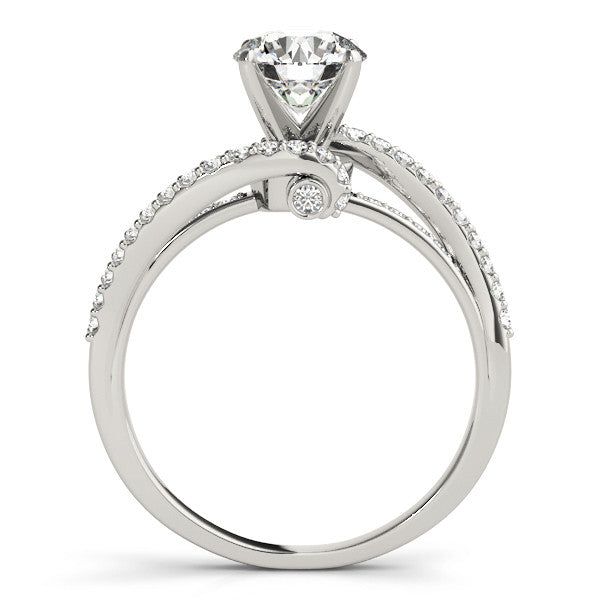 a white gold engagement ring with diamonds on the side