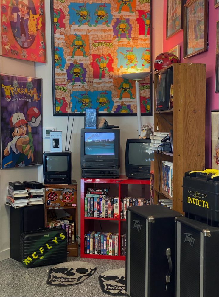 a room filled with lots of different types of video game equipment and posters on the wall