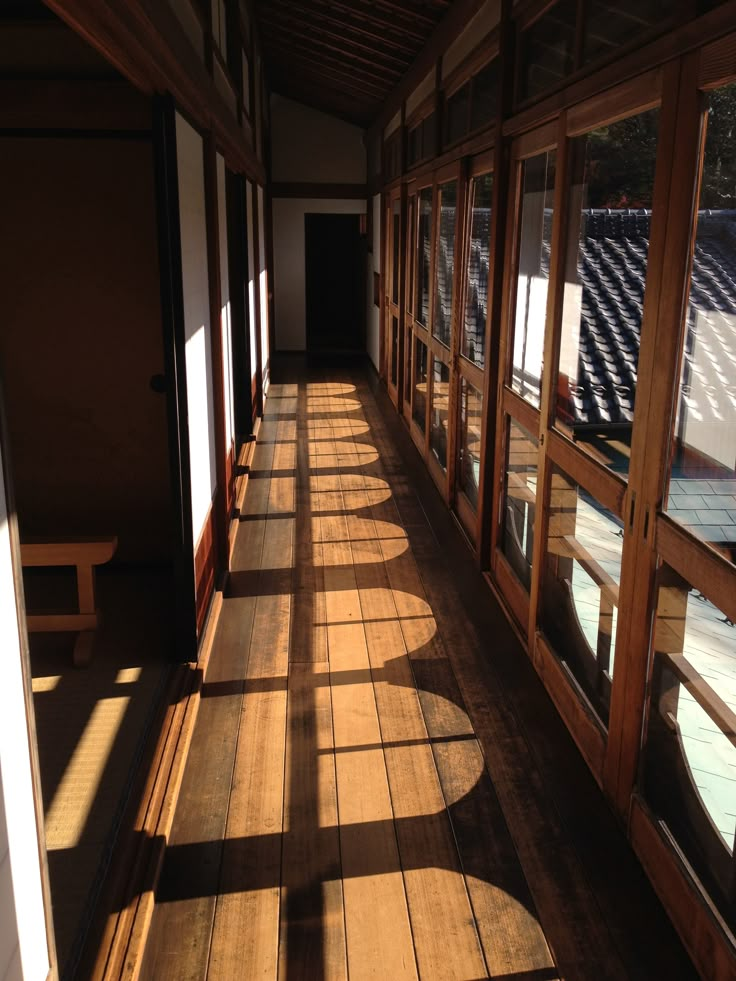 the sun shines through windows in an empty building