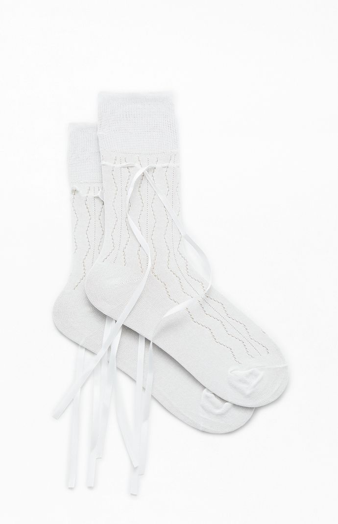 Add a playful twist to your outfit with the Ribbon Bow Socks from PacSun. Made from soft knit fabric, these socks feature charming ribbon ankle details that add a touch of sweetness to your look. Whether you're dressing up or keeping it casual, these socks are the perfect accessory to elevate your look.


	Solid color socks
	Knit fabric
	Ribbon bow details
	One size fits most Ribbon Socks, Coquette Socks, Coquette Socks Aesthetic, Socks Bow, Coquette Knee Socks, Knee High Bow Socks, Colorful Socks, Big Bows, Fabric Ribbon