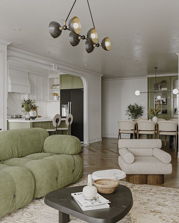 a living room filled with furniture and a chandelier hanging over the top of it