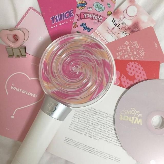 the contents of a personal care product are displayed on a white sheet with pink tags