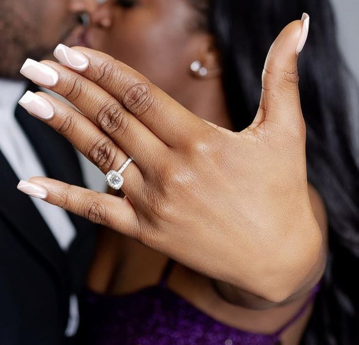 a man and woman with wedding rings on their fingers