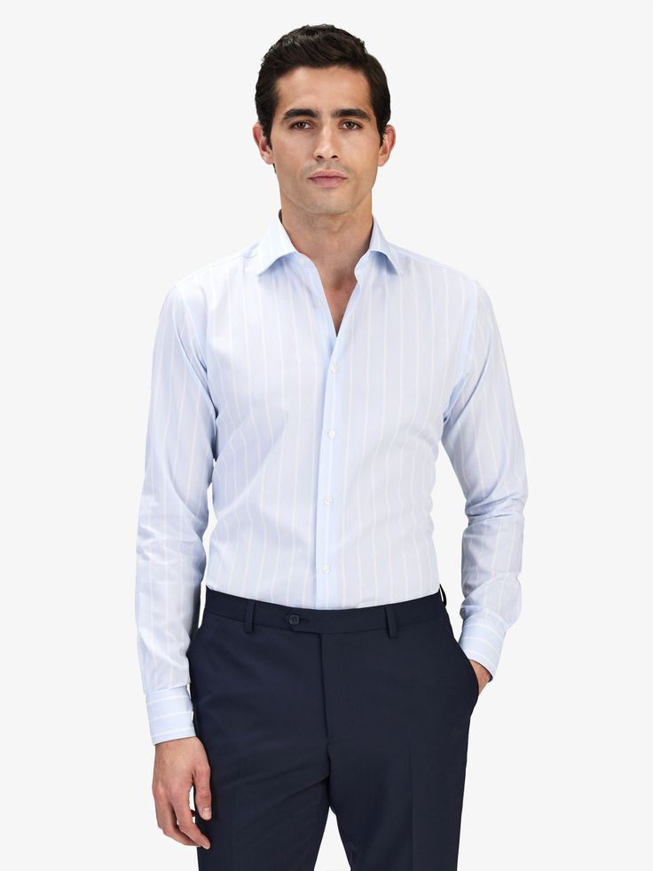 Men’s striped shirts - Light blue striped shirt.
Add a little extra detail to your looks with a striped shirt and pair it with your favorite workwear outfit. Whatever your style, add some interest with a striped men's shirt. 

Striped shirts are timeless for both formal and casual occasions. Go ahead and add an eye-catching edge to formal and casual ensembles with our striped shirts
Material: 100% Cotton Striped Cotton Shirt For Semi-formal Occasions, Blue Striped Shirt For Work, Blue Vertical Stripe Shirt For Work, Blue Vertical Striped Shirt For Work, Office Cotton Shirt With Vertical Stripes, Pinstripe Shirt With Contrast Stripes For Work, Pinstripe Top With Striped Collar For Business Casual, Elegant Blue Shirt With Vertical Stripes, Pinstripe Dress Shirt With Striped Collar For Business