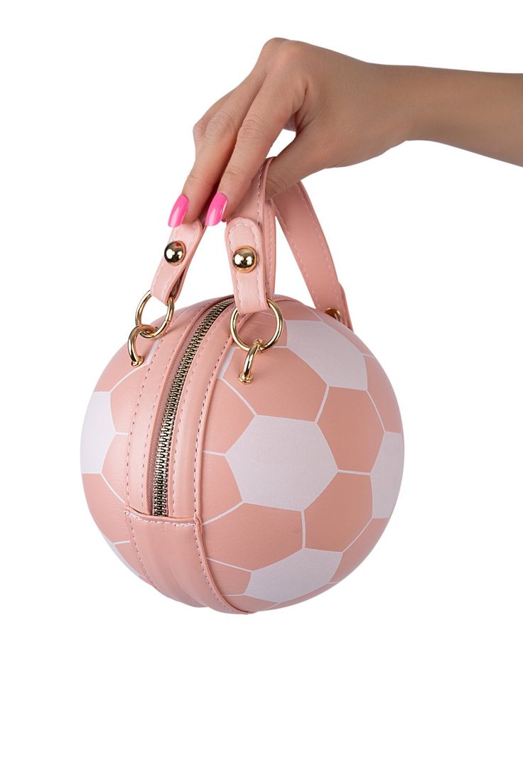 Hey, Sporty Spice! Meet our Goal Getter Leather Handbag, the ultimate accessory for our sporty girls looking to bring the spirit of the field to their everyday style. This unique bag combines the love for sports with a touch of femininity, featuring a pink and white design that mimics the iconic soccer ball pattern. Soccer Ball Inspired Design Pink and White Color Small and Compact Size Features a Wrist Strap Leather Material Sporty Bags For Football Season, Sporty Crossbody Shoulder Bag For Sports Events, Pink Sporty Travel Bag, Sporty Pink Bag With Zipper Closure, Sporty Large Capacity Pink Shoulder Bag, Sporty Pink Bag For Sports, White Sporty Crossbody Bag, Sporty White Crossbody Bags, Sporty Pink Shoulder Bag With Removable Pouch