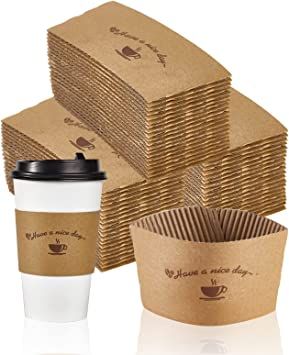 coffee cups are stacked on top of each other next to some brown paper napkins