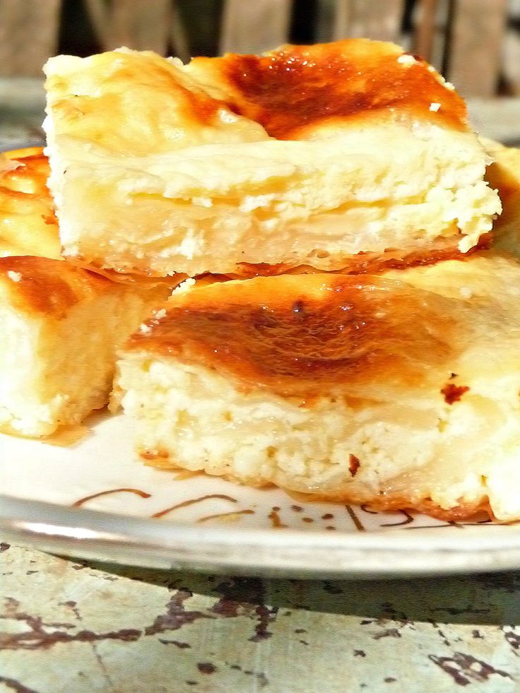 three pieces of cheesecake sitting on top of a plate